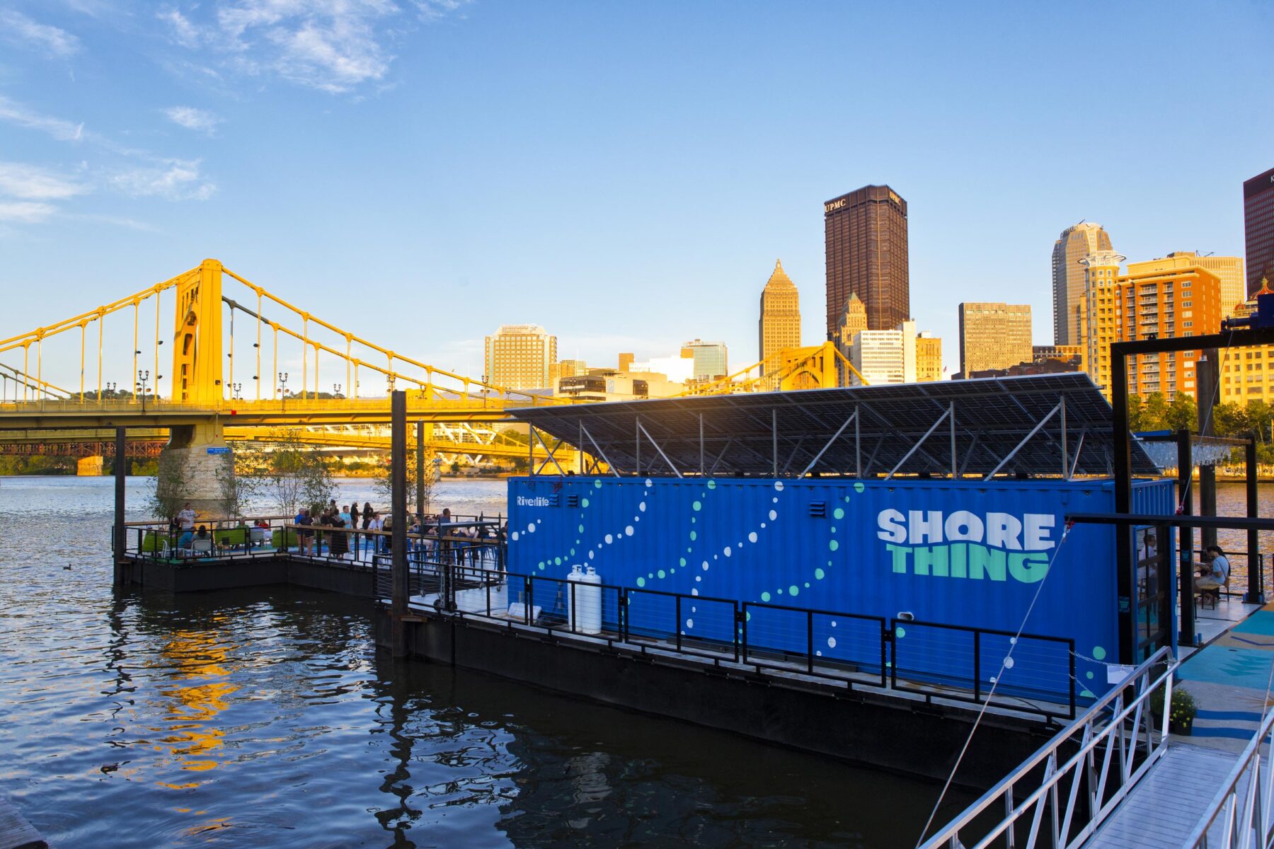 Photo of the Shore Thing installation from the shore, with the Pittsburgh skyline in the background.